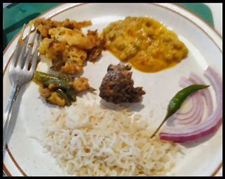 Indian Food - Jeera Rice, Mushroom-Peas Curry, Mixed Vegetable Curry, Spinach Pakora