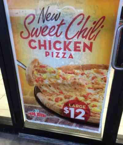 Papa John's Sweet Chilli Chicken Pizza Ad at Store Entrance