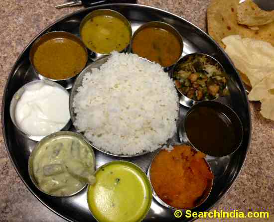 Indian Thali with Curry, Rice, Desserts, Chapati